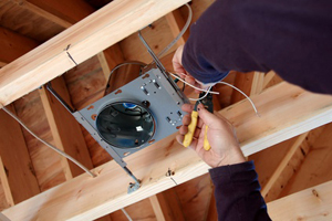 electritian installing light box in new home